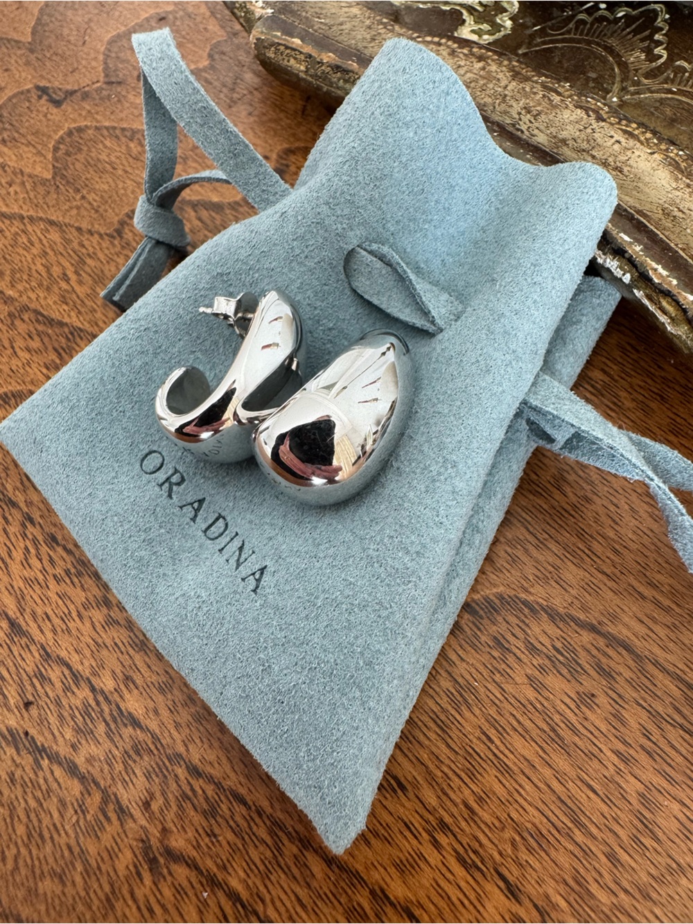 Silver Sculptural Hoop Earrings on Suede Pouch